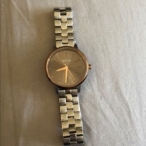 Nixon watch silver with lining gold on silver face